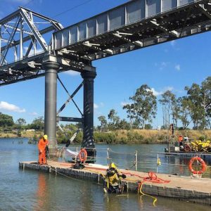 Team at work completing Pile remediation - Burnett River Qld - CMG